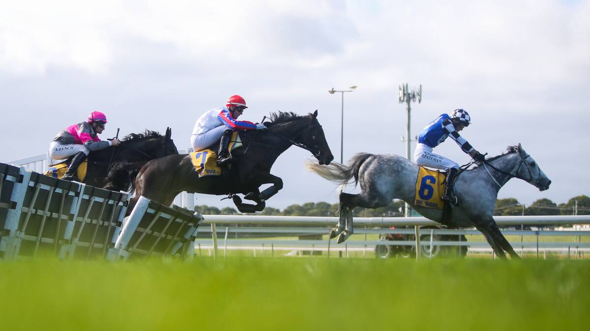 Horses launch over a jump in the Sovereign Resorts Galleywood Hurdle. Picture: Morgan Hancock