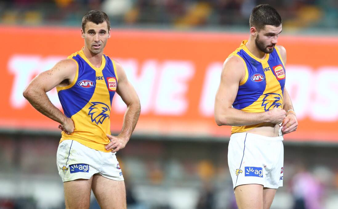 NO FUN: West Coast's Jamie Cripps and Jarrod Brander look on after a Brisbane goal. Picture: Getty Images