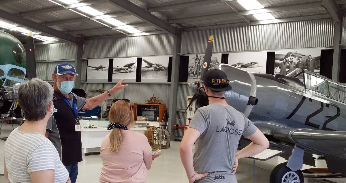 INTEREST: Len Creek explains the story of the Wirraway to visitors. Picture: Supplied