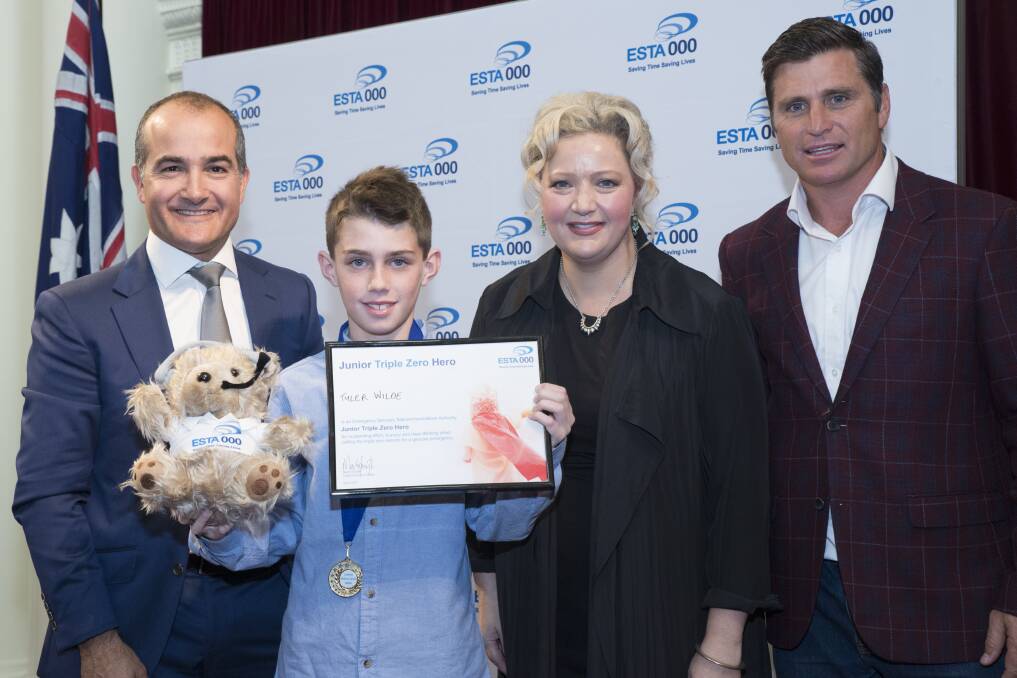 HERO: Ararat youngster Tyer Wilde with Emergency Services Minister James Merlino, Health Minister Jill Hennessy and former AFL footballer Shane Crawford. Picture: CONTRIBUTED