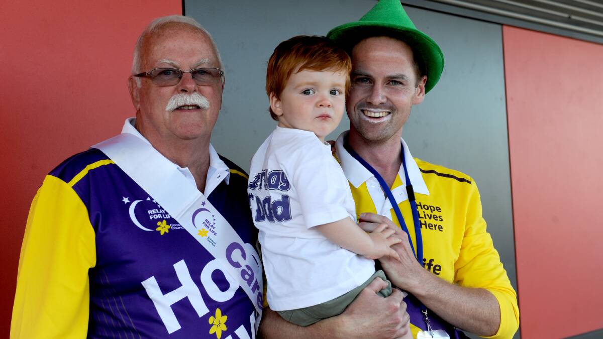 HOPE: Three generations of the Amor family, Anthony Amor, Charlie Amor and cancer survivor Justin Amor at the Horsham and District Relay For Life. Picture: OLIVIA PAGE