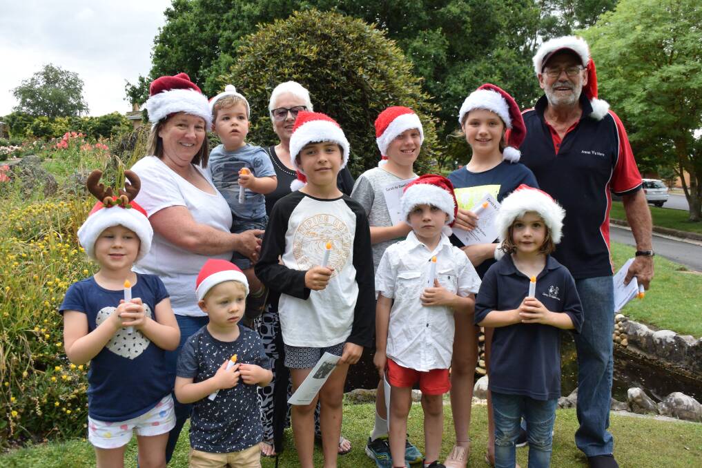 CAROLS TIME: The Day, Potter and Bartlett children gather with Carols by Candlelight co-ordinator Joe Perry to prepare for the annual event in Ararat's Alexandra Gardens. Picture: REX MARTINICH