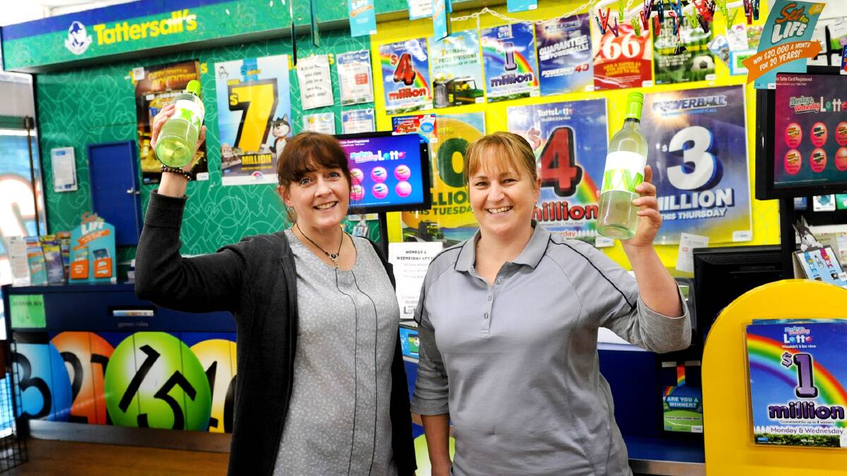 Horsham Newsagency staff Dianne Richards and Nicole Drendel celebrate the sale of a $1.57 million winning ticket from Saturday's super $22 million draw. Picture: SAMANTHA CAMARRI.