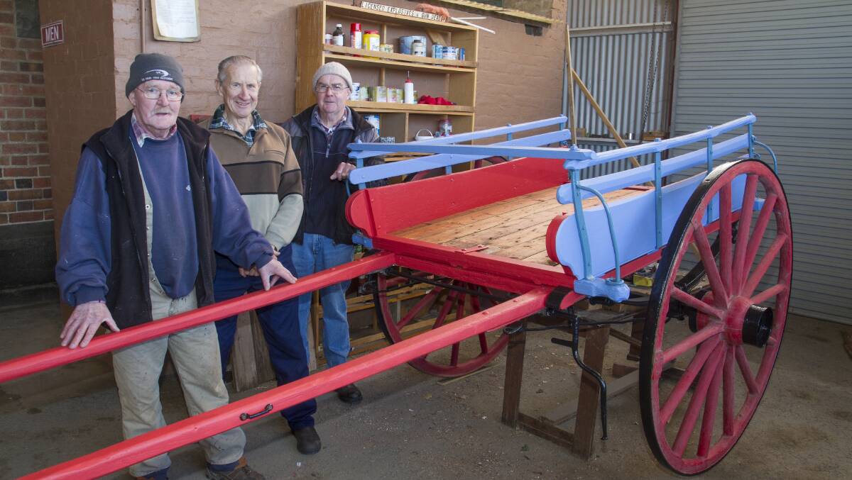 Langi Morgala Museum volunteers Greg Falls, Laurie Brewster and Bernie Tobin with the restored tipper wagon Picture: PETER PICKERING