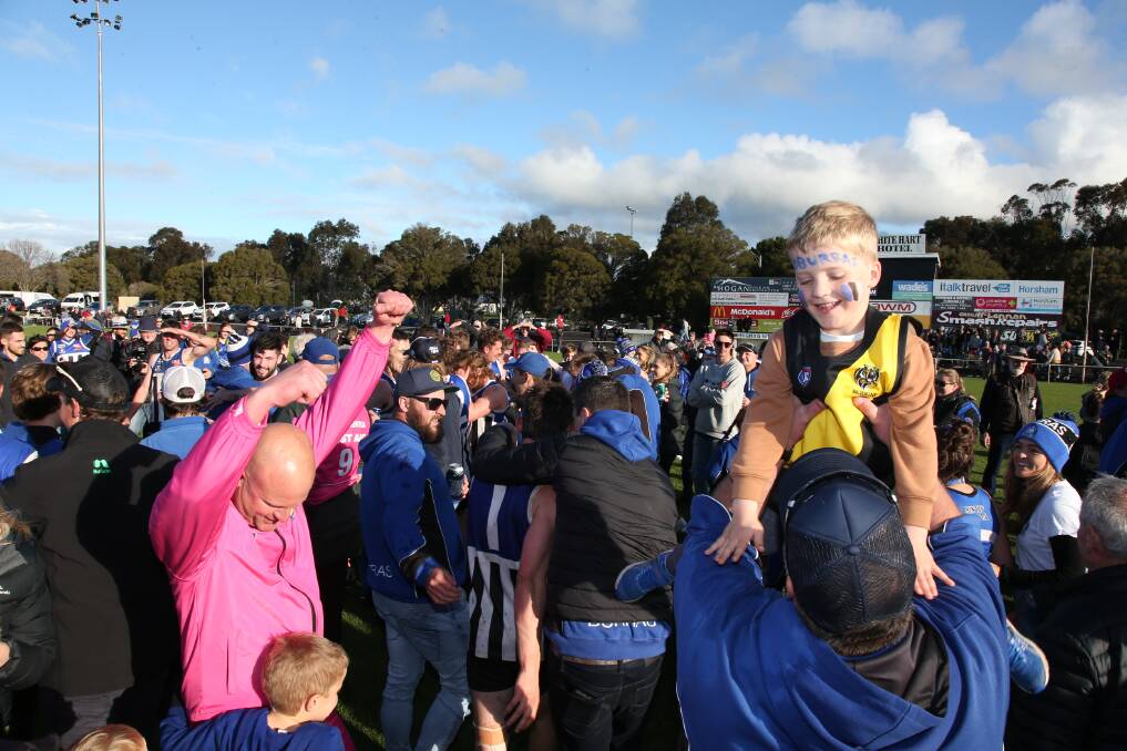 Players and fans of Minyip-Murtoa celebrate after winning the 2019 senior football and A Grade netball grand final.