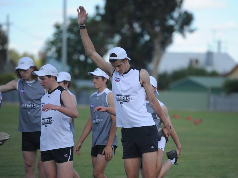 Rebels hopefuls go through their warm-up at a training session in Horsham in November.