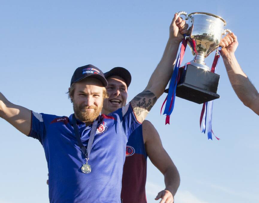 Roberts lifts the Wimmera league's premiership cup in 2018.
