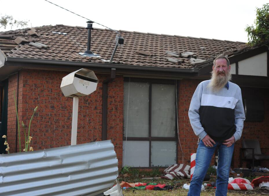 Grahame Madex outside his damaged residence.