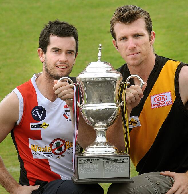 Matt Combe and Shannon Argall promoting the Anzac Day clash between Horsham Saints and Horsham United in 2011.