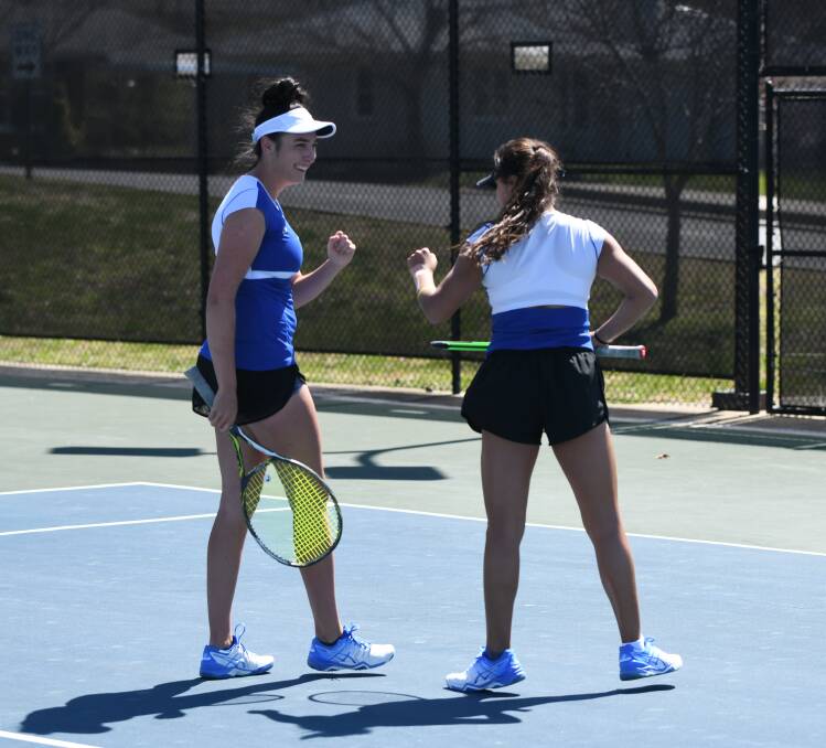 McDonald celebrates with a teammate in a doubles contest. Picture: LINDSEY WILSON ATHLETICS