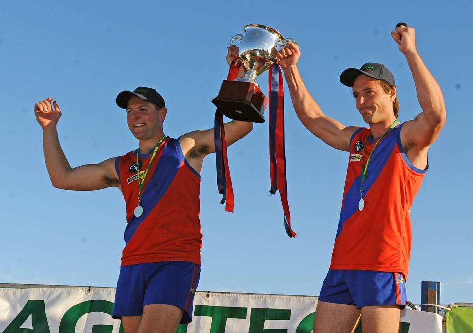 Schultz and Jay Tucker with the 2009 premiership cup.