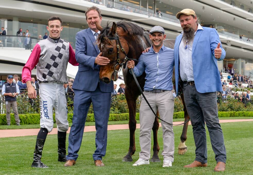 Jockey Jordan Childs and trainer Paul Preusker with Surprise Baby (NZ) after winning The Bart Cummings at Flemington Racecourse. Picture: Reg Ryan/Racing Photos