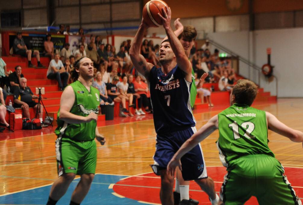 Tim Pickert slices through the Warnambool defense on his way to a lay-up in his 300th game for the Hornets. Picture: RICHARD CRABTREE
