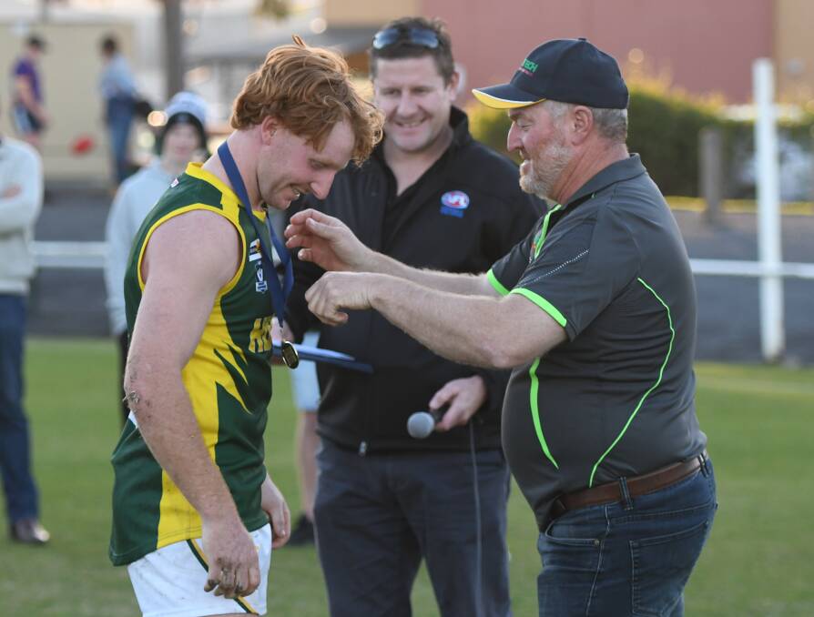 Eric Guthrie recieves the medal for best on ground from interleague coordinator Fred Mellington.