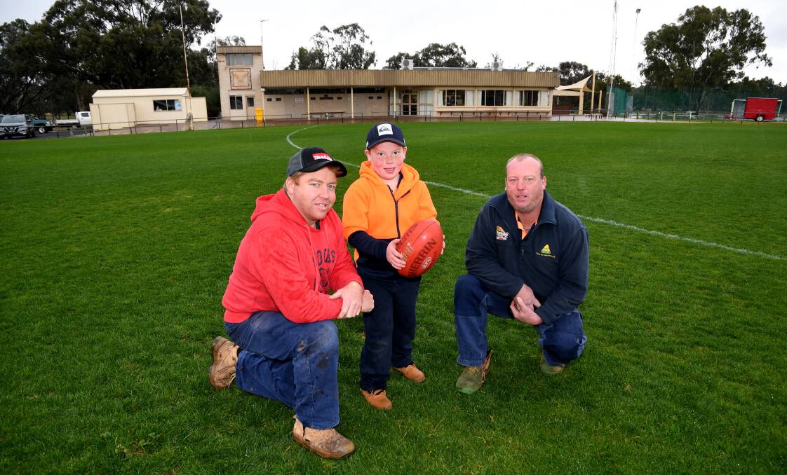 EXCITED: Brim Sports and Social Club secretary Graeme Holland, Oliver Holland and Brim Sports and Social Club board member Mathew Crisp inspect the surface at Brim in 2018. Picture: SAMANTHA CAMARRI
