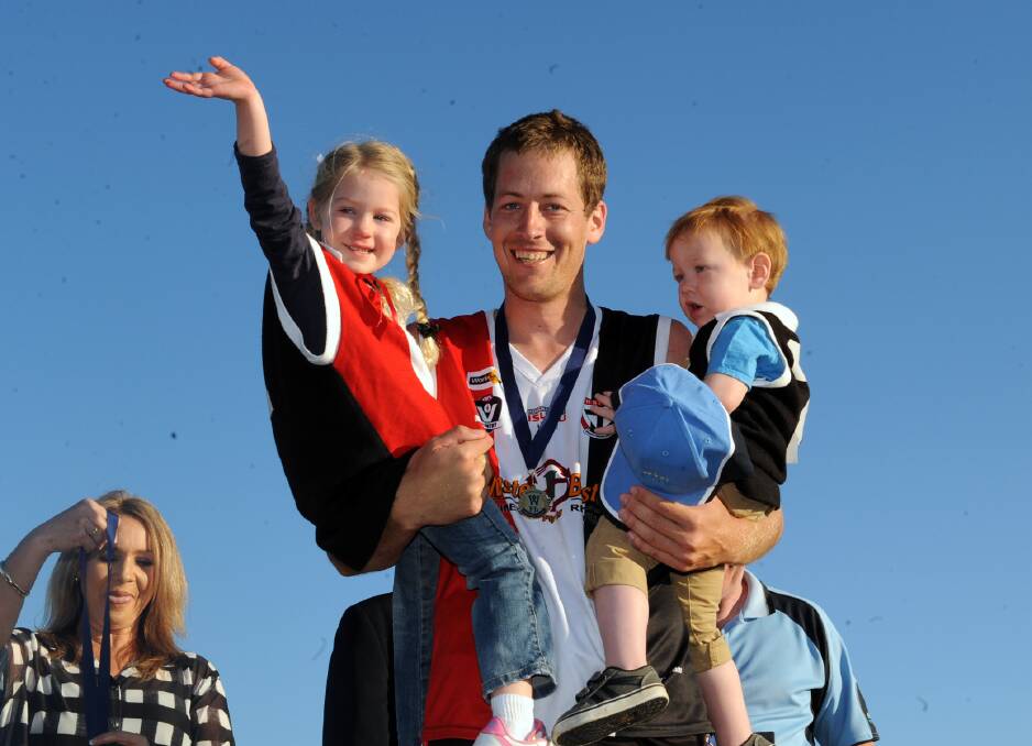 Michael Rowe celebrates with his two young kids.