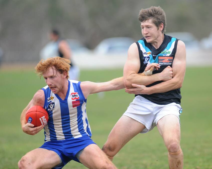 Harrow-Balmoral's Eric Guthrie palms off Swifts' Jakob Davis and bursts away from the contest. Picture: RICHARD CRABTREE