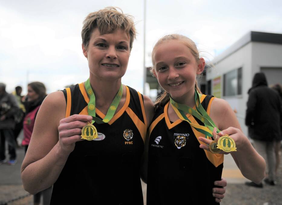 Maree and Tahlia with their C Reserve premiership medals.