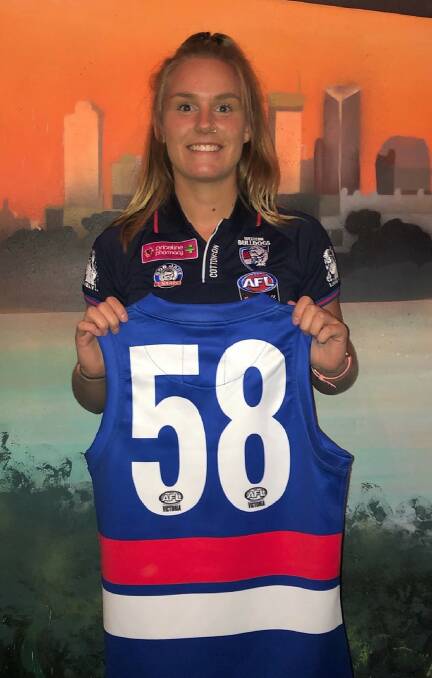 Wood gets presented her Bulldogs jumper after signing on. Picture: CONTRIBUTED