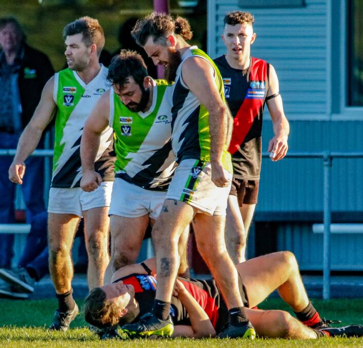 Jeparit-Rainbow's Sean Pratt and Tom Eichner try to intimidate Dustin Cross. Picture: PETER DOXEY PHOTOGRAPHY