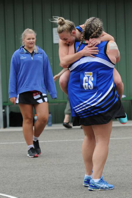 Hayley Campbell jumps into the arms of Kirby Knight after the Burras preliminary final victory. Picture: MATT CURRILL