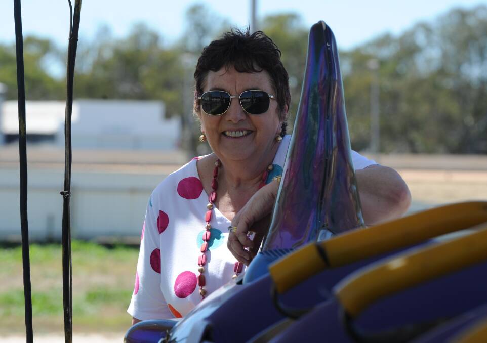 READY: Festival committee president Di Bell aboard one of the rides set up at the Horsham Showgrounds. Picture: RICHARD CRABTREE