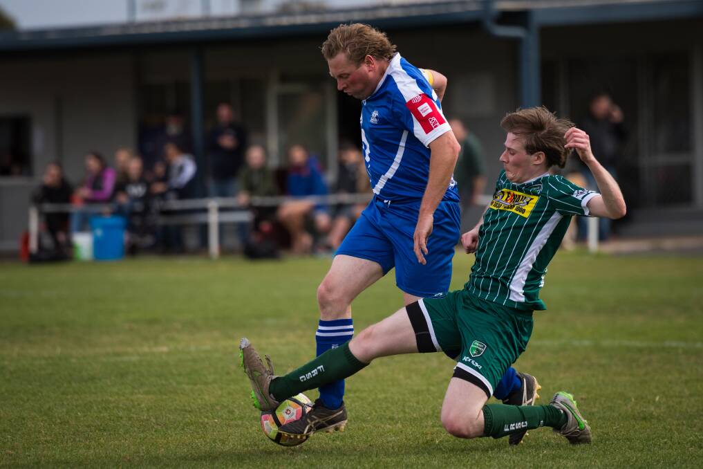 Horsham Falcons' 2020 senior coach James Hibberd tries to dribble around an opponent. Picture: DARREN ISAAC
