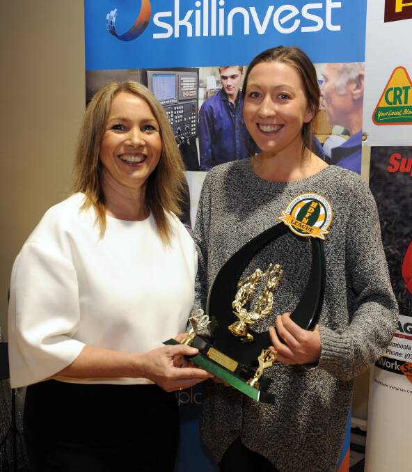 Donna Winfield presents Emma Ryan with the league best and fairest in 2015. 