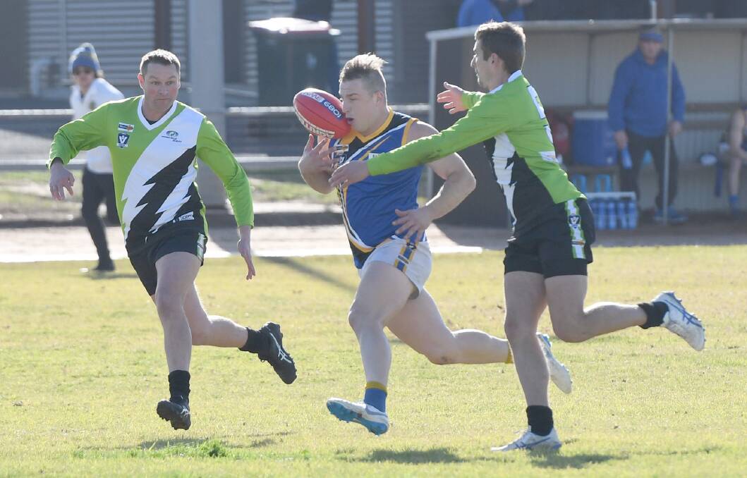 The District league's leading goalkicker Jaydon Stiles tries to control the ball.