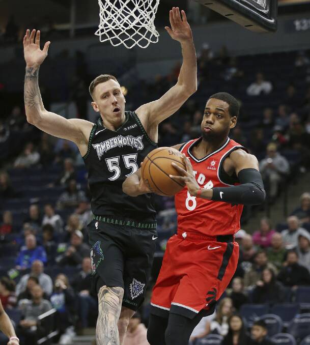 DEFENCE: Mitch Creek flies to defend while playing for the Minnesota Timberwolves. Creek said he is excited to return to Horsham to host clinics for junior basketballers. Picture: AP PHOTO/STACY BENGS
