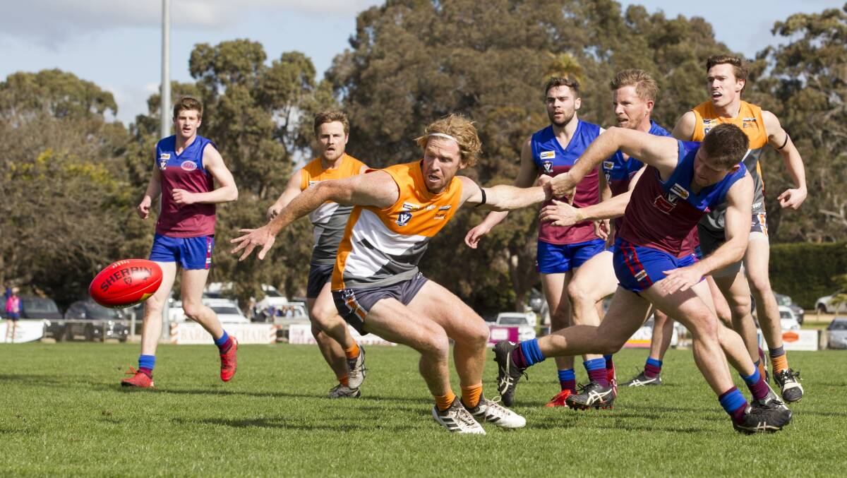 Nick O'Farrell chases after the football against the Demons in 2018.
