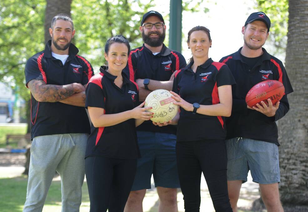 The Bombers' recruits and netball coaches ahead of the 2020 season. Damien Cameron, Megan Byrne, Justin Chilver, Fiona Rowe and Tom Magee.