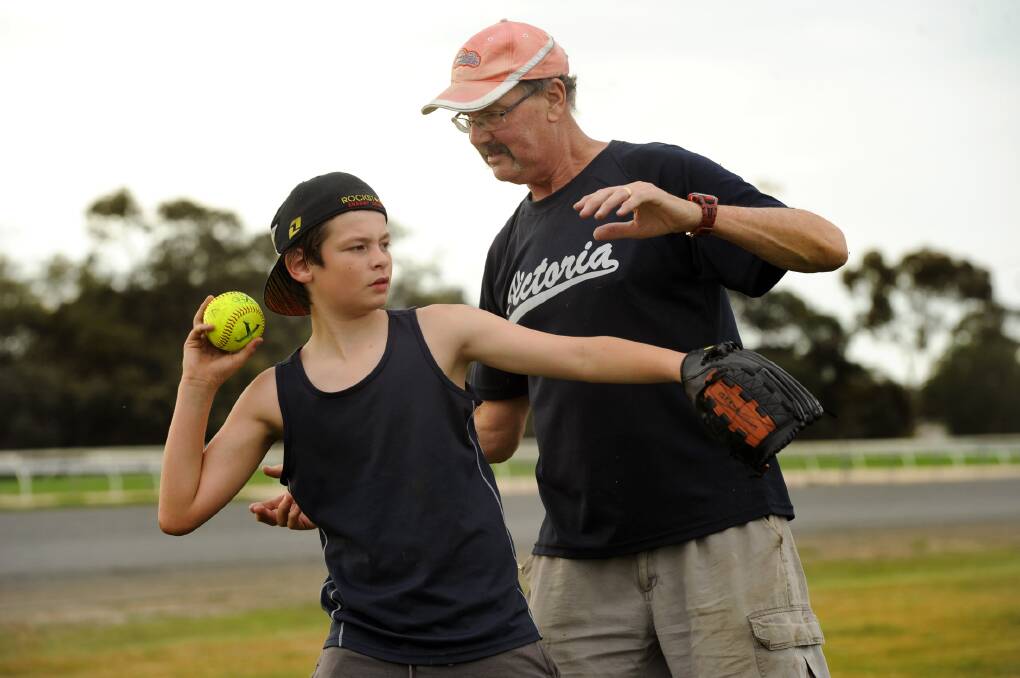 Mr Farrell teaching softball at a come-and-try day in 2011.