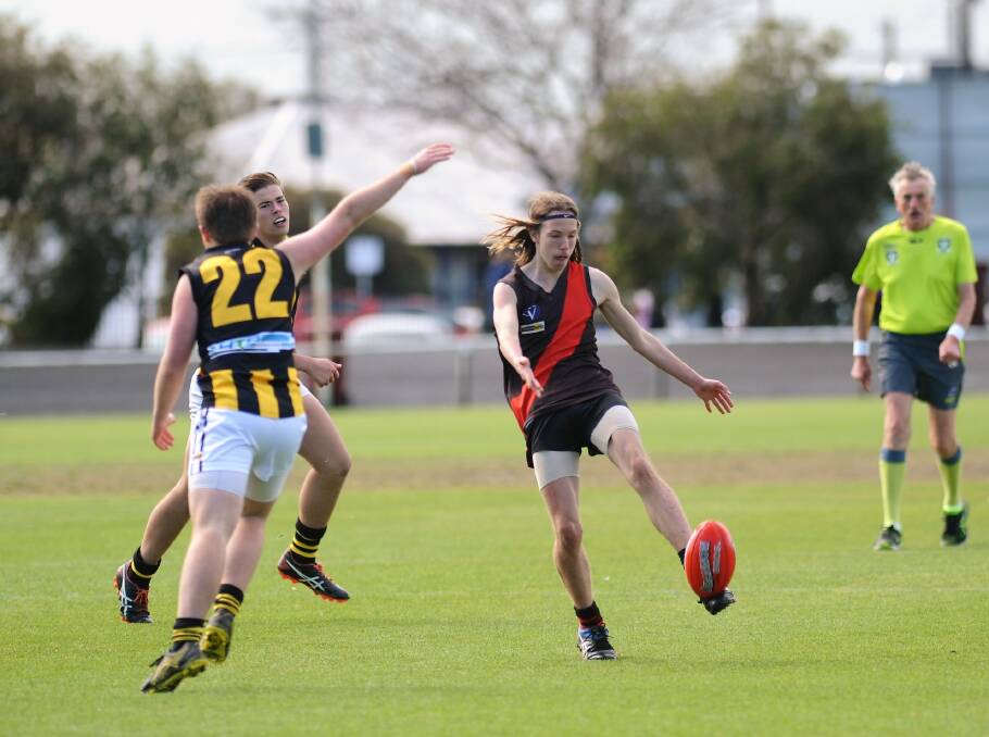 Noradjuha-Quantong's Riley Dunlop gets a kick away in the 2018, under-17s grand final. 