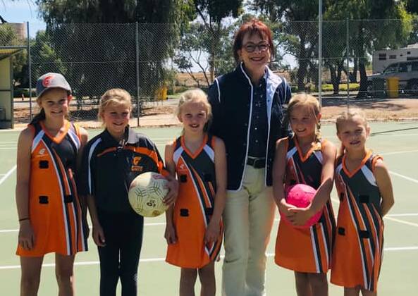 Nationals candidate for Mallee Anne Webster with several junior Giants netballers at the club's Beulah courts. Picture: MEGAN THOMPSON