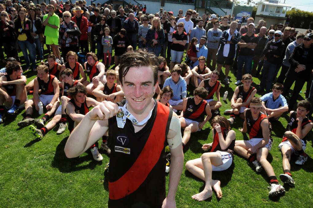 Bailey McQueen shows off his best on ground medal after the 2015 grand final. 