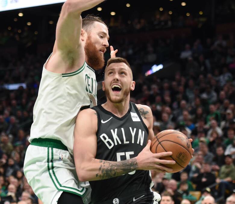 Mitch Creek drives on fellow Australian Aron Baynes during his stint in the NBA with the Brooklyn Nets. Picture: BOB DECHIARA/USA TODAY SPORTS