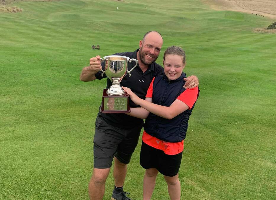 CHAMPIONS: Brent and Izabella McIntyre with the Victorian Mixed Four Ball State Championship trophy. Picture: CONTRIBUTED