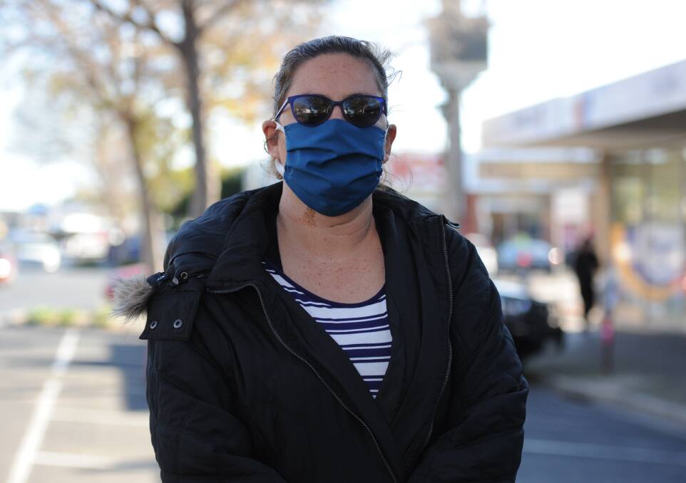 Holli Duckworth wearing a home-made mask in Horsham on Friday. Picture: RICHARD CRABTREE