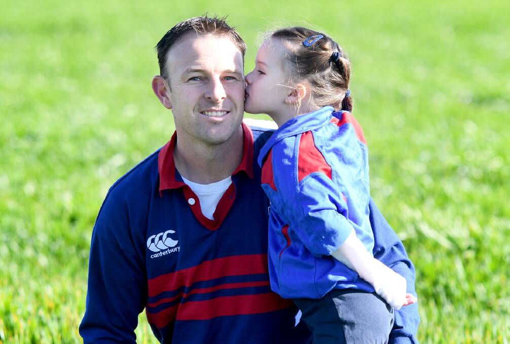 Rupanyup's Paul Trotter with his daugther Ella ahead of his 300th game. Picture: SAMANTHA CAMARRI