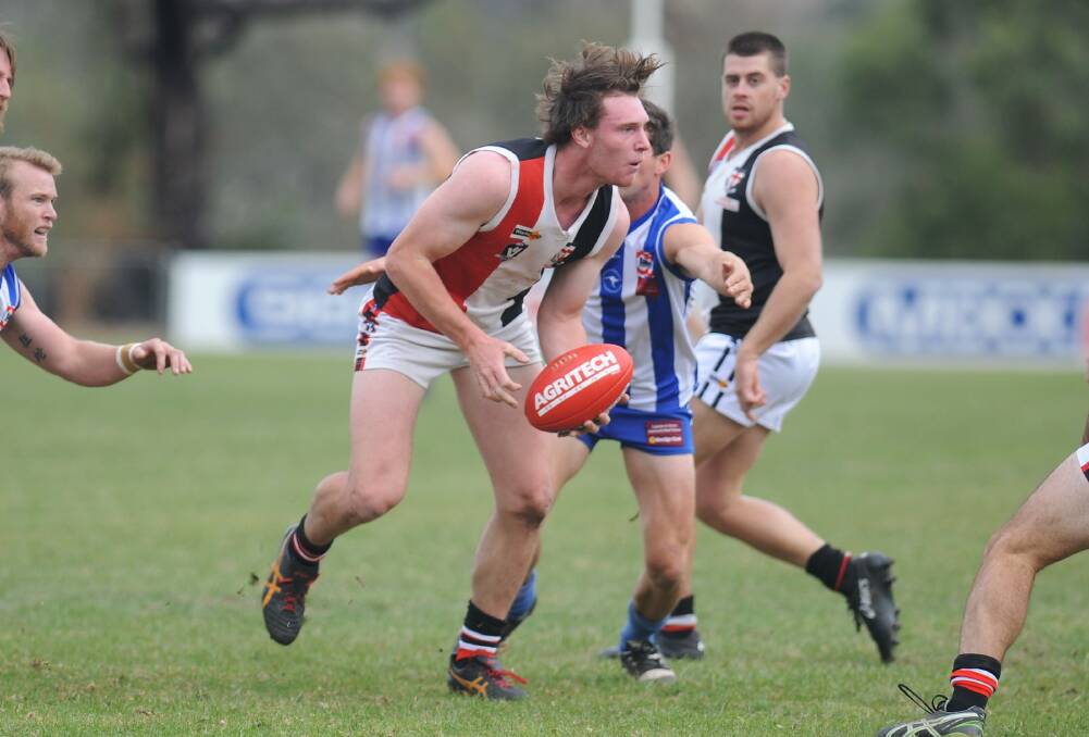 SPLITTING THE PACK: Lachlan Middleton evades several Harrow-Balmoral opponents in round four. Picture: RICHARD CRABTREE
