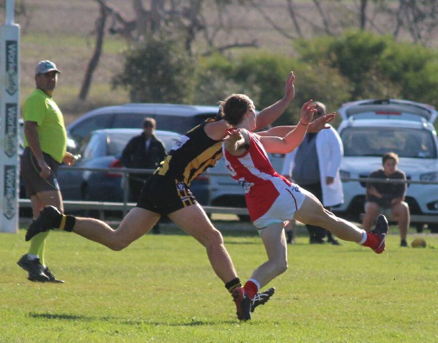 Phelan roosts a ball into the forward 50 during Taylors Lake's drought-breaking win against Pimpinio last year. 
