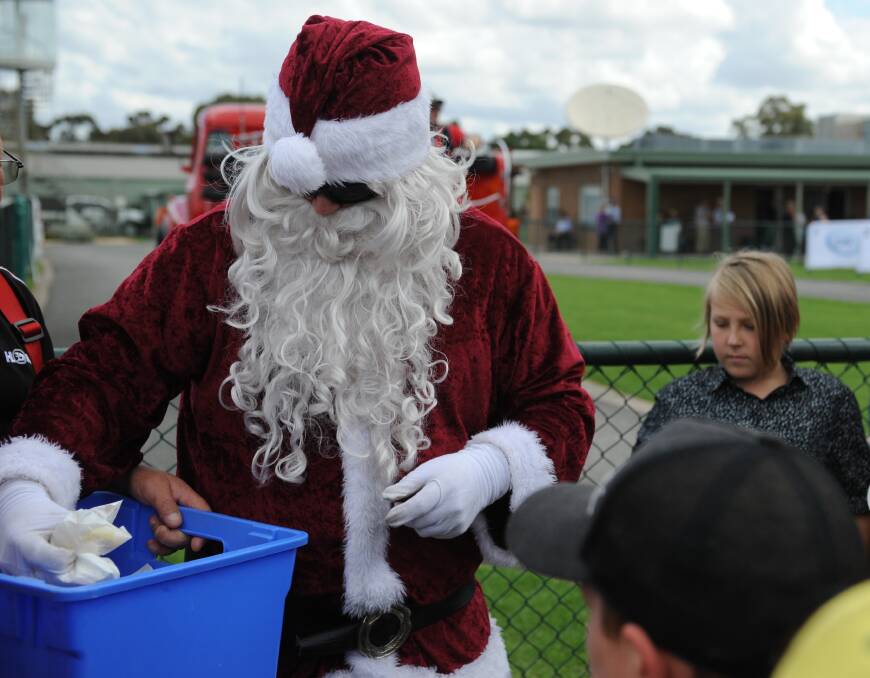 Santa handing out gifts at the event in 2018.