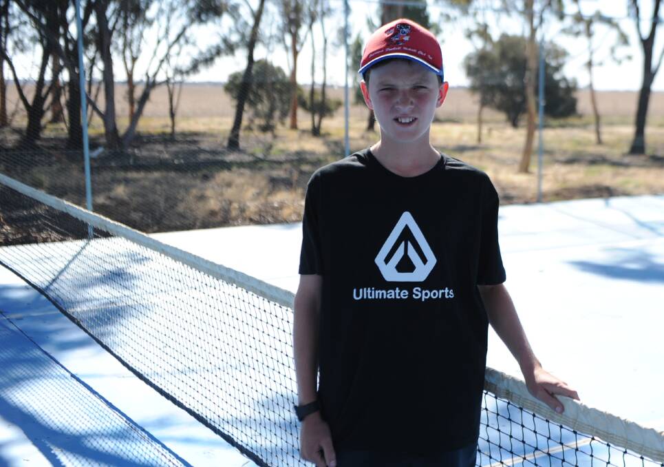 Connor Weidemann on his family's tennis court on a farm near Rupanyup, wearing the "Ultimate Sports" brand clothing he and his siblings created. Picture: RICHARD CRABTREE