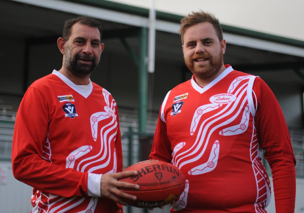 PROUD: Benno Muir and 'Cobba' Harrison show off the Taylors Lake Indigenous guernsey to be worn on Saturday. Picture: RICHARD CRABTREE