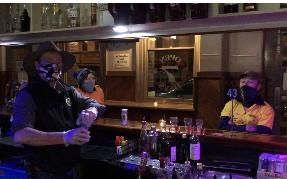 Royal Hotel publican Grant Fiedler pours a beer at 12am on Thursday morning. Picture: CONTRIBUTED