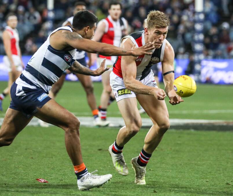 Seb Ross gets a handball away against Geelong. Picture: COREY SCICLUNA
