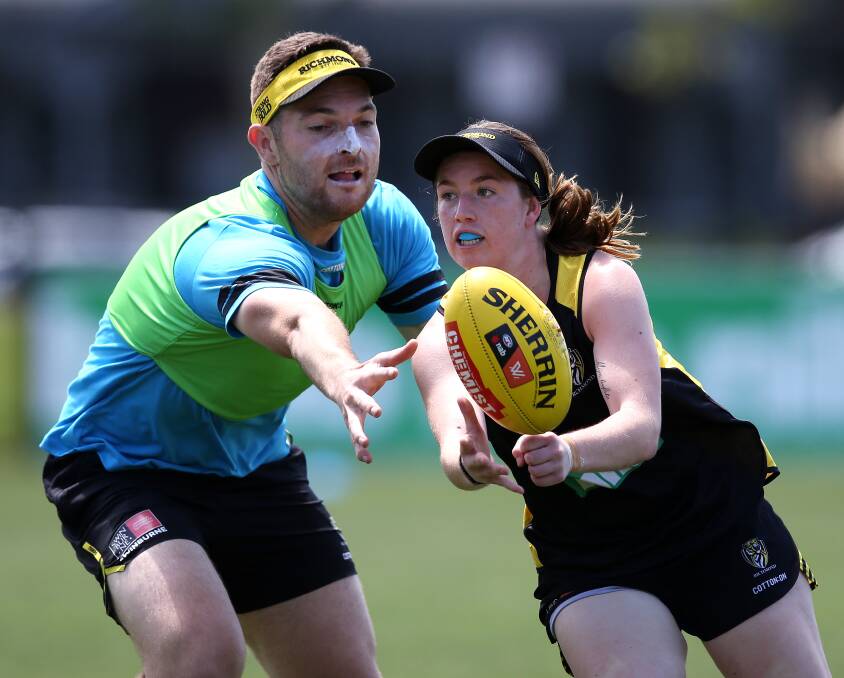 HANDS: Nekaela Butler gets a handball away at training with the Richmond Tigers. Picture: RICHMOND MEDIA