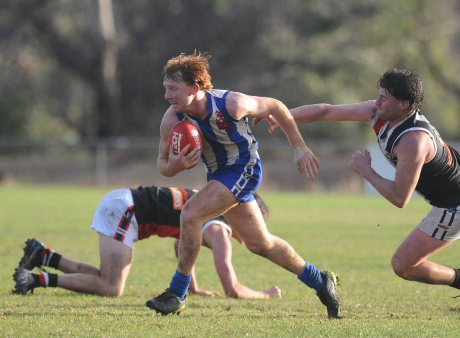 Guthrie bursts through a pack of players against Edenhope-Apsley earlier this season.