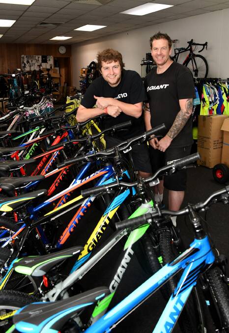 Employee Daniel Sonego and owner Damien Cook in 2017 after Horsham Cyclery shifted to a new location.